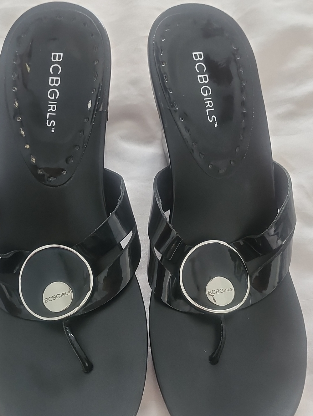 BCBGirls Black Patent Thong Sandals with Silver Accent Medallions
